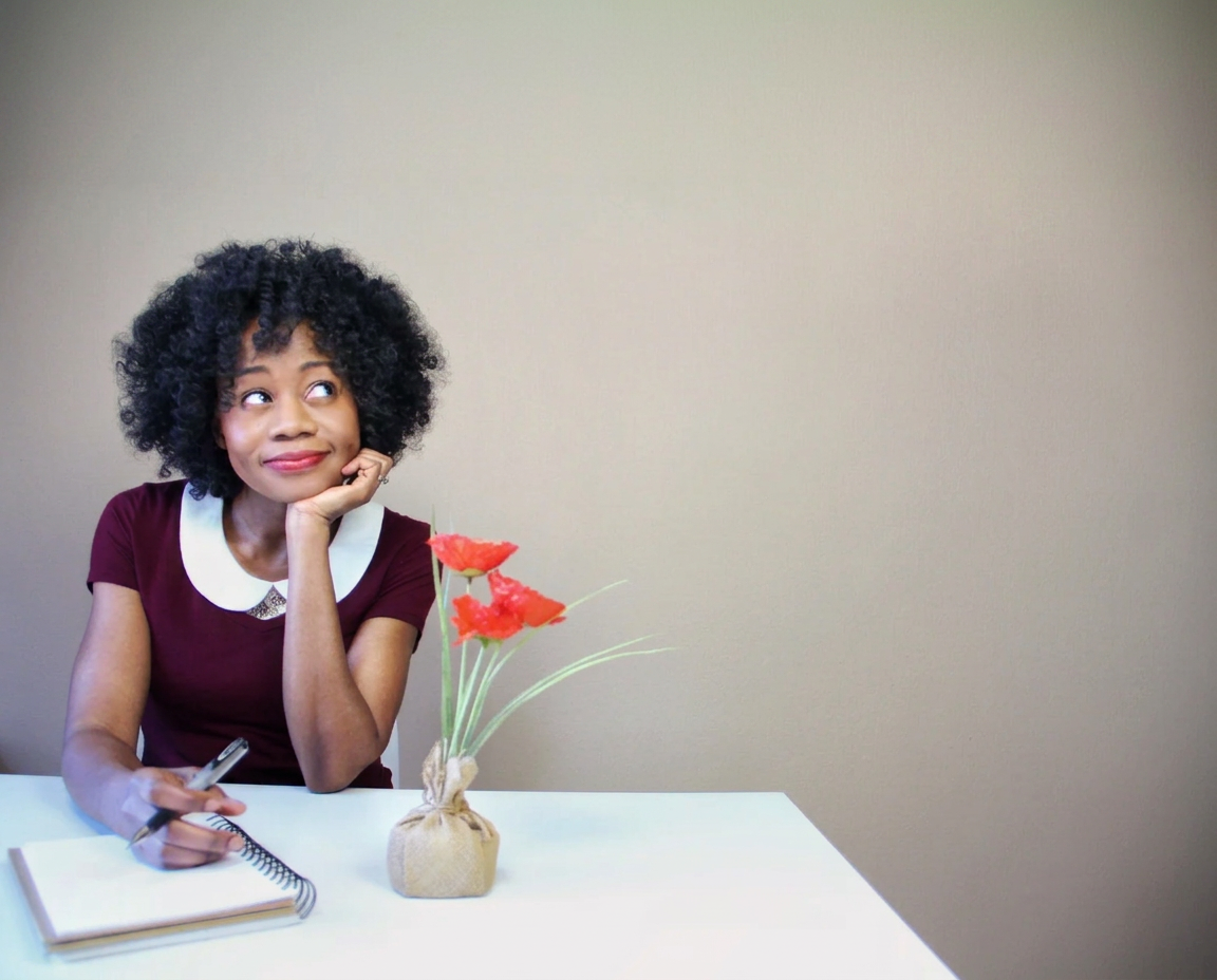 Liz F. Bradley, Ink Well Coach founder, at her desk